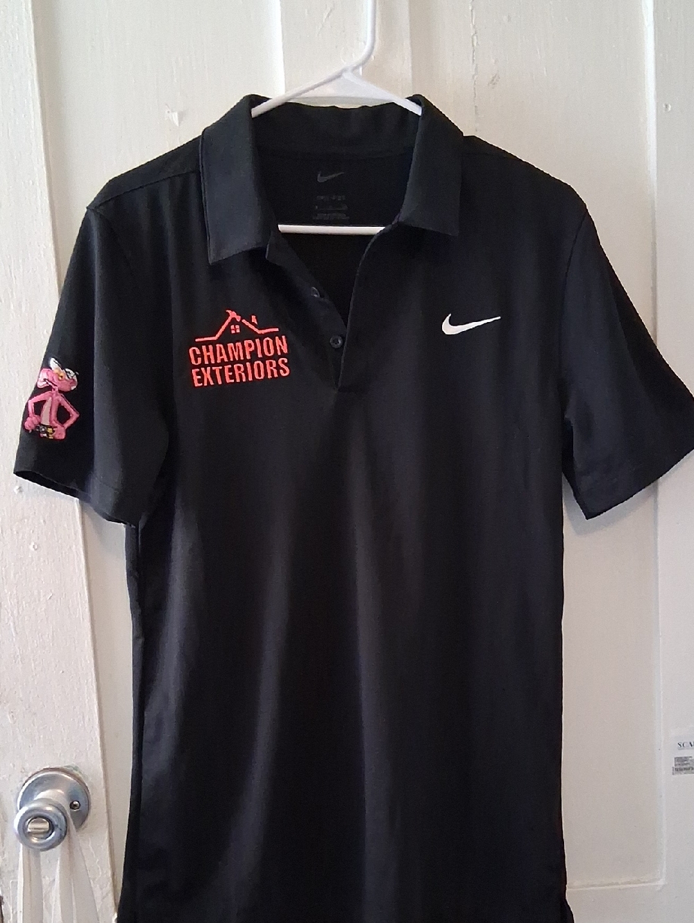 Nike Men’s Black Polo with White Swoosh and Pink Panther Patch